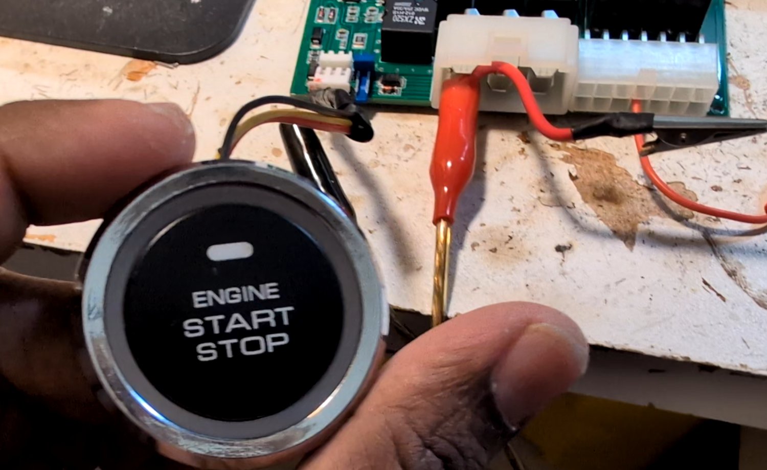The push-to-start button port on the board.