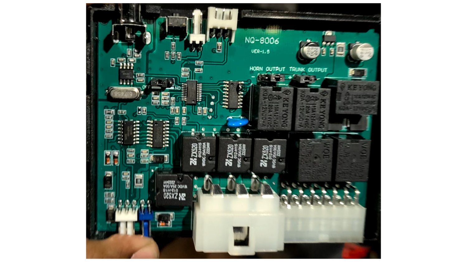 Tracing the region around the RF receiver IC to find where its decoded output connects to a microcontroller.