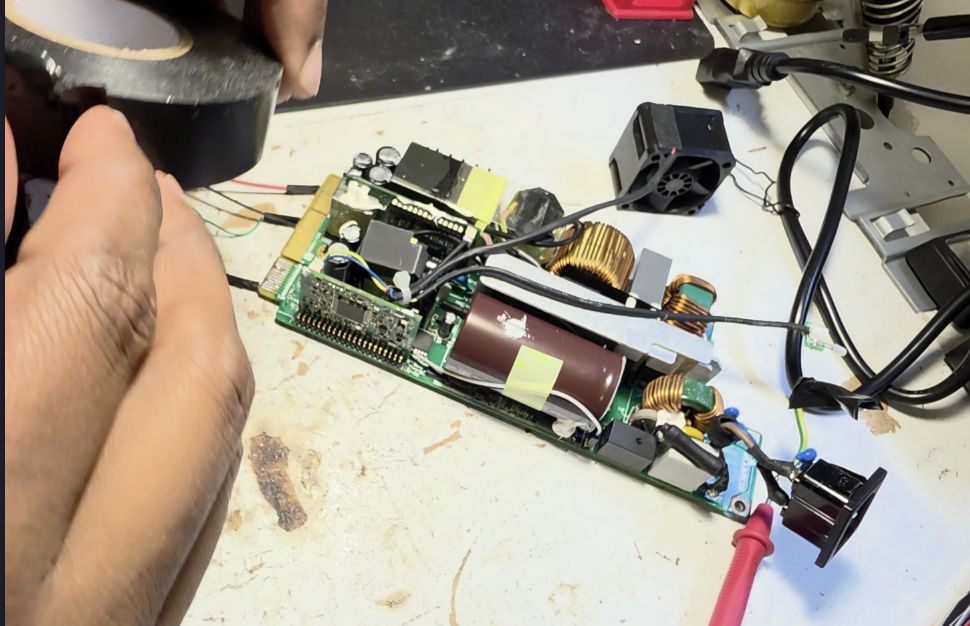 Exposed terminals covered in electrical tape to prevent accidental shorts.