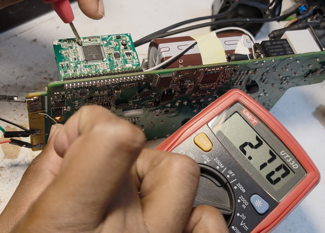 Confirming the reading with the meter.