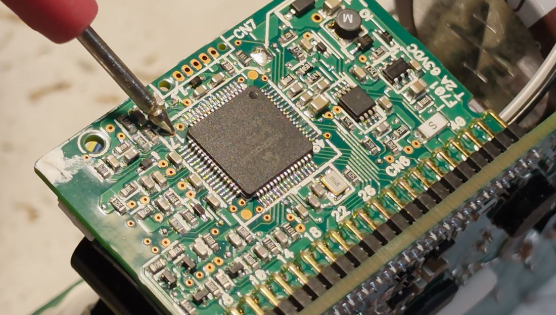 Adjacent pin tracking the main 12 V output on the daughterboard.