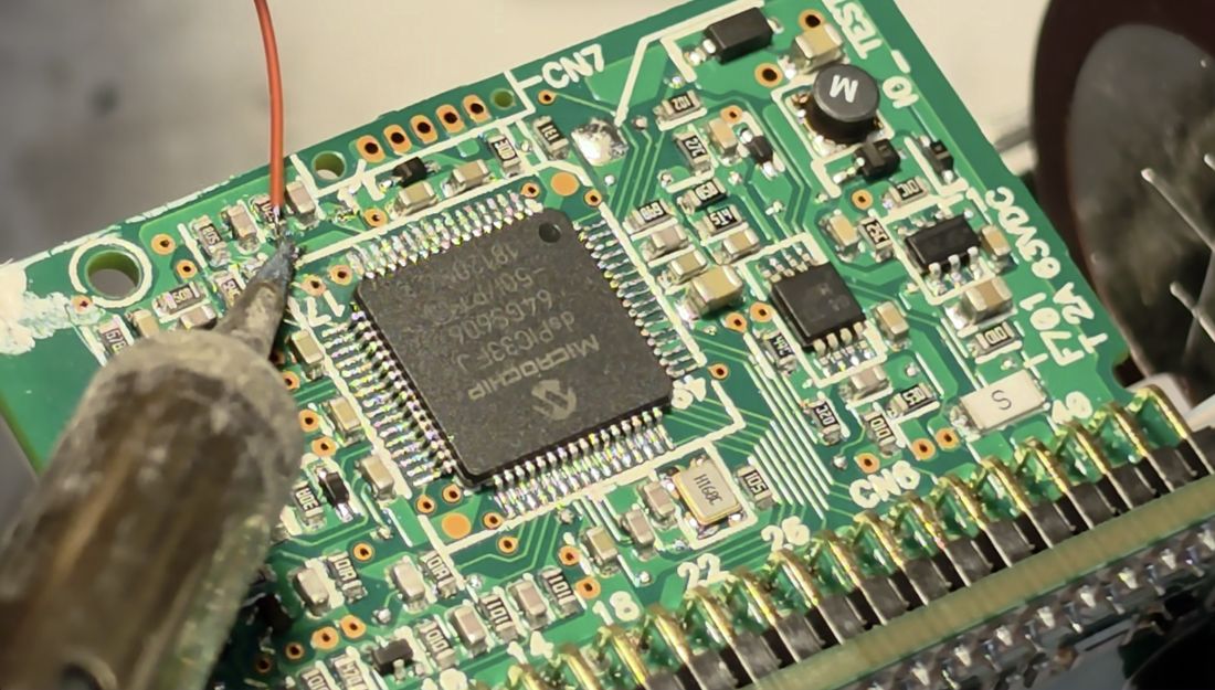 Tie-wire soldered onto the divider midpoint test points.