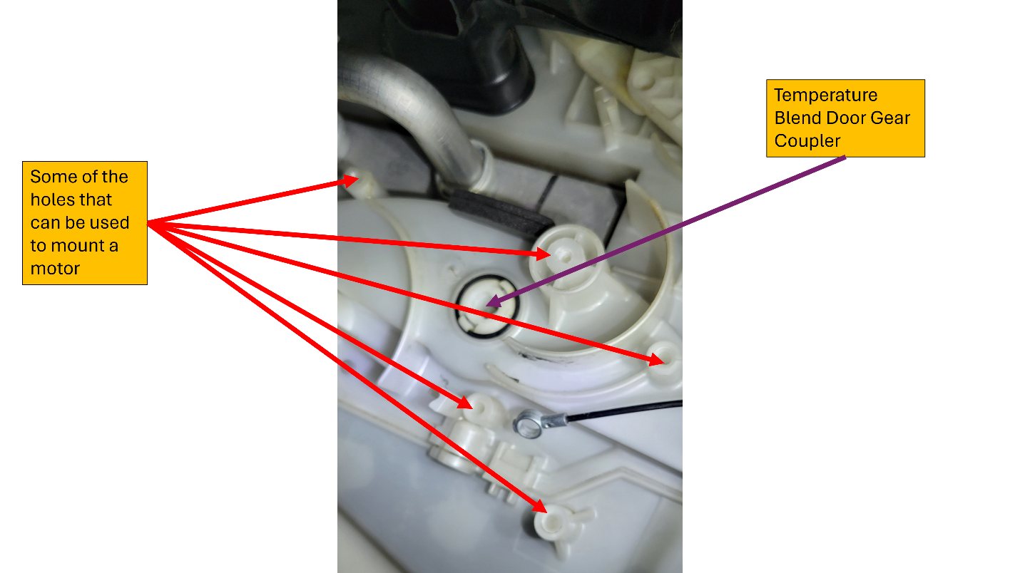 The AC blend door actuator with the factory lever mechanism removed, exposing mounting holes.