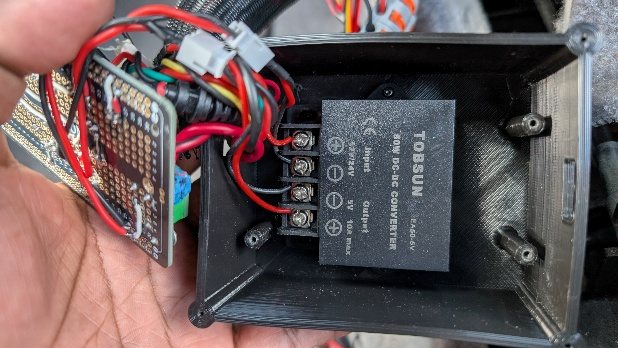 The buck converter mounted inside the 3D printed enclosure.