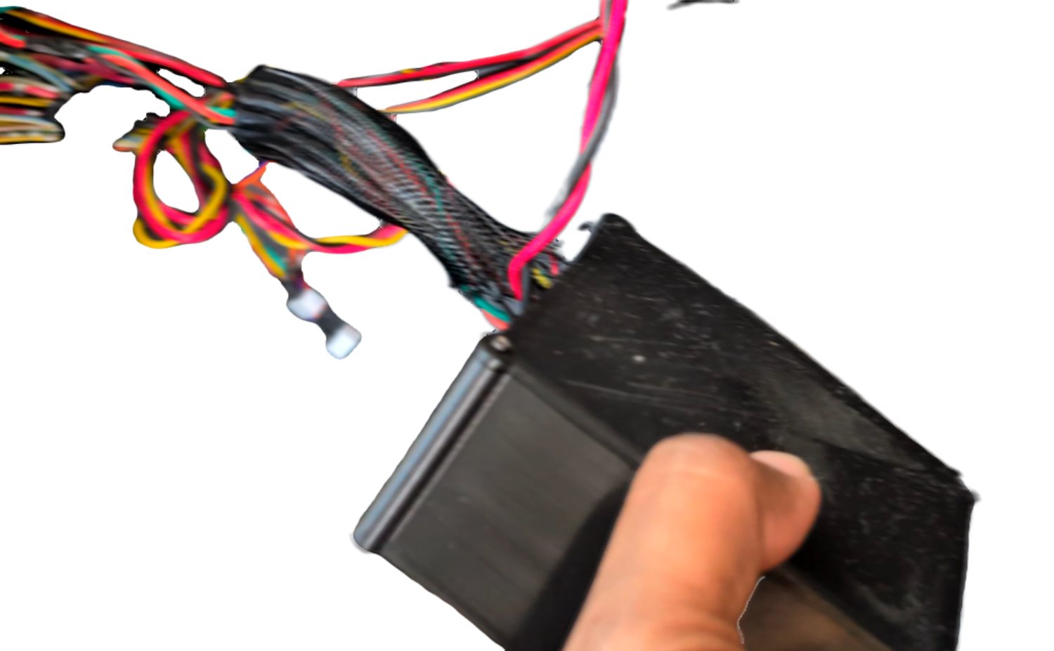 Cables routed through the enclosure's harness opening.