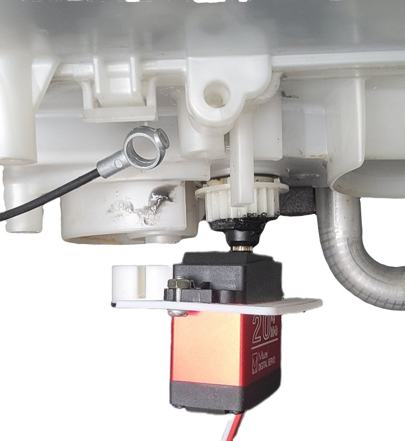 A close-up of the servo's output shaft coupled to the temperature blend door's gear via an early bracket revision.