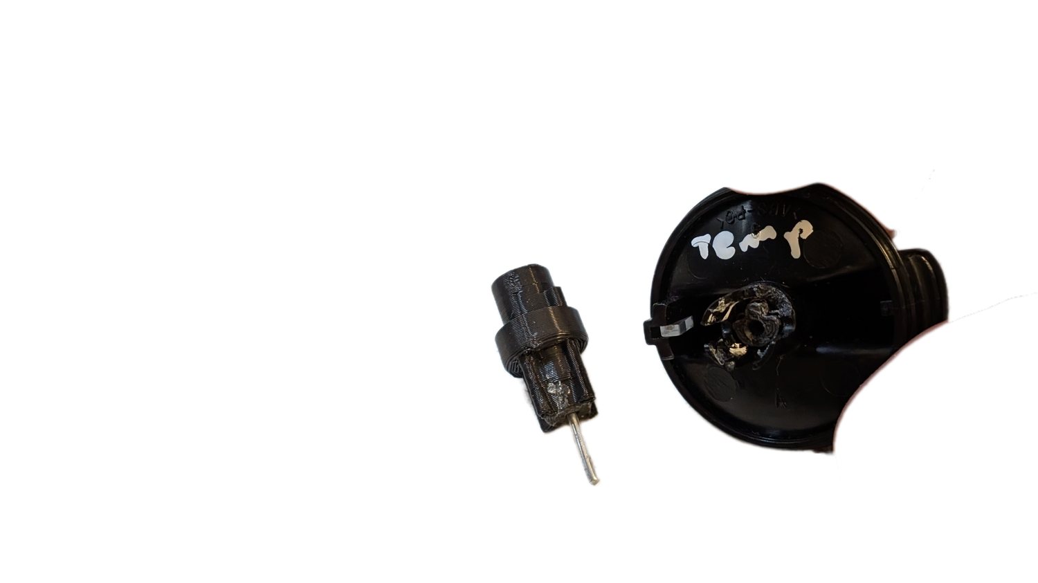 Photo of the metal dowel pin next to the 3D printed coupler on the left and the knob on the right, before final assembly.