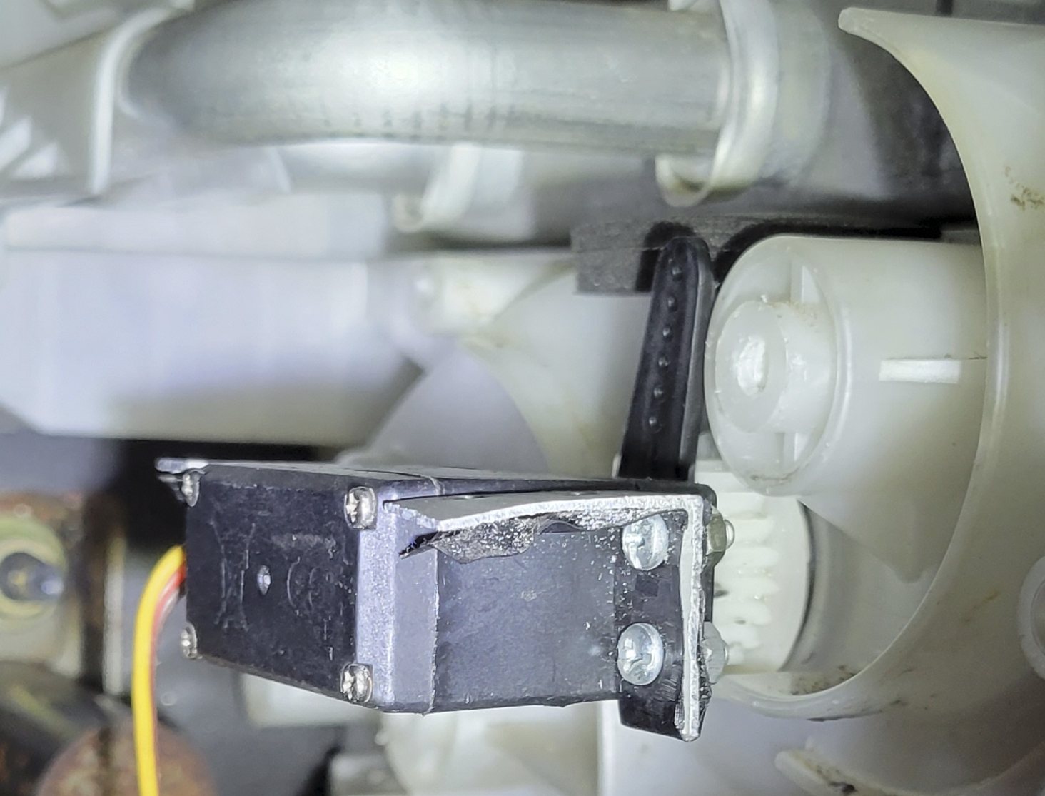 Testing a smaller stepper motor against the blend door gear, which it was unable to turn.