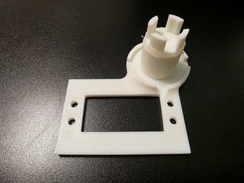 A third angle of the printed test skeleton, showing the pin geometry designed to key into the actuator holes.