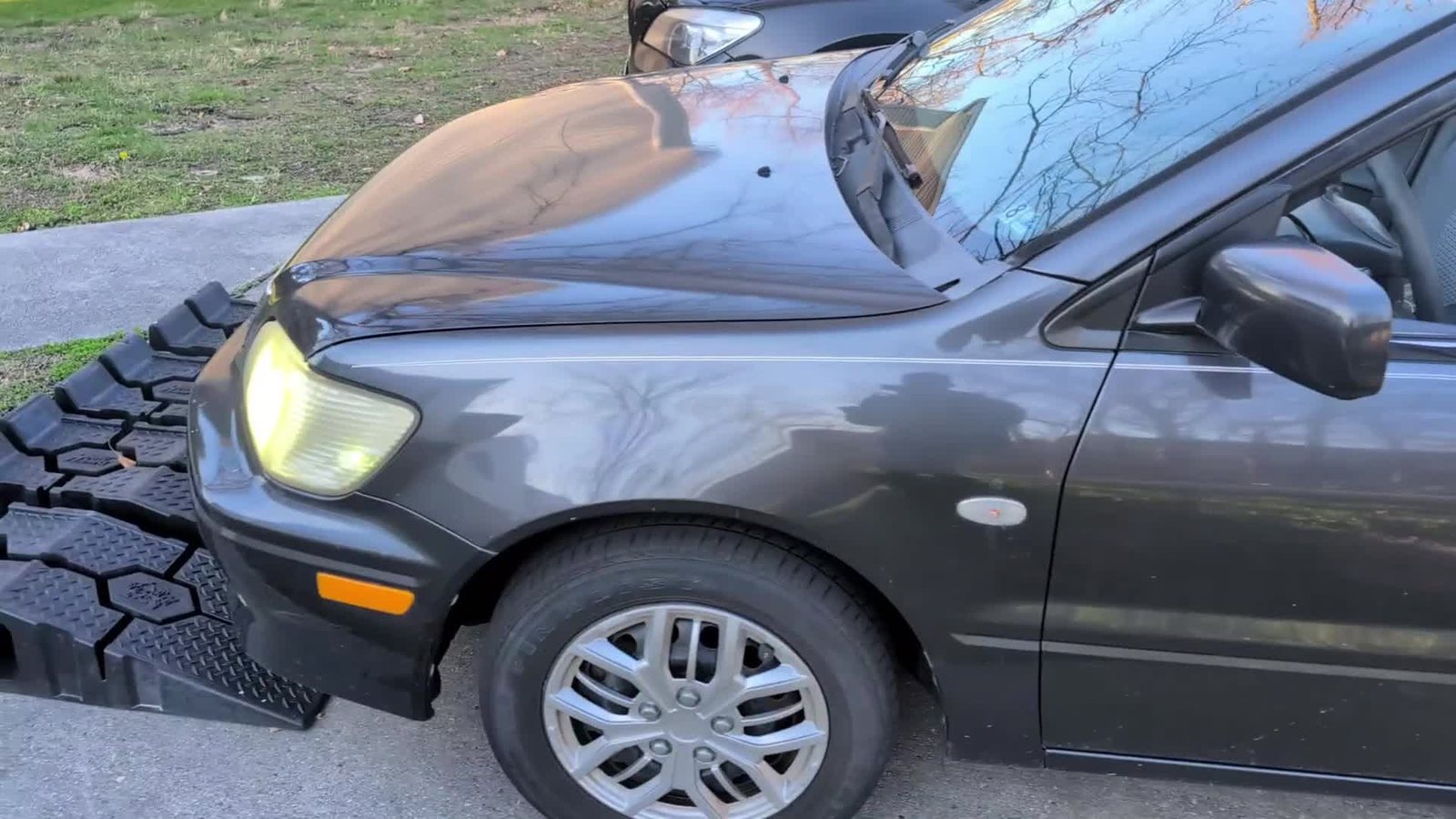 The Lancer with its headlights on after a voice-triggered remote start.