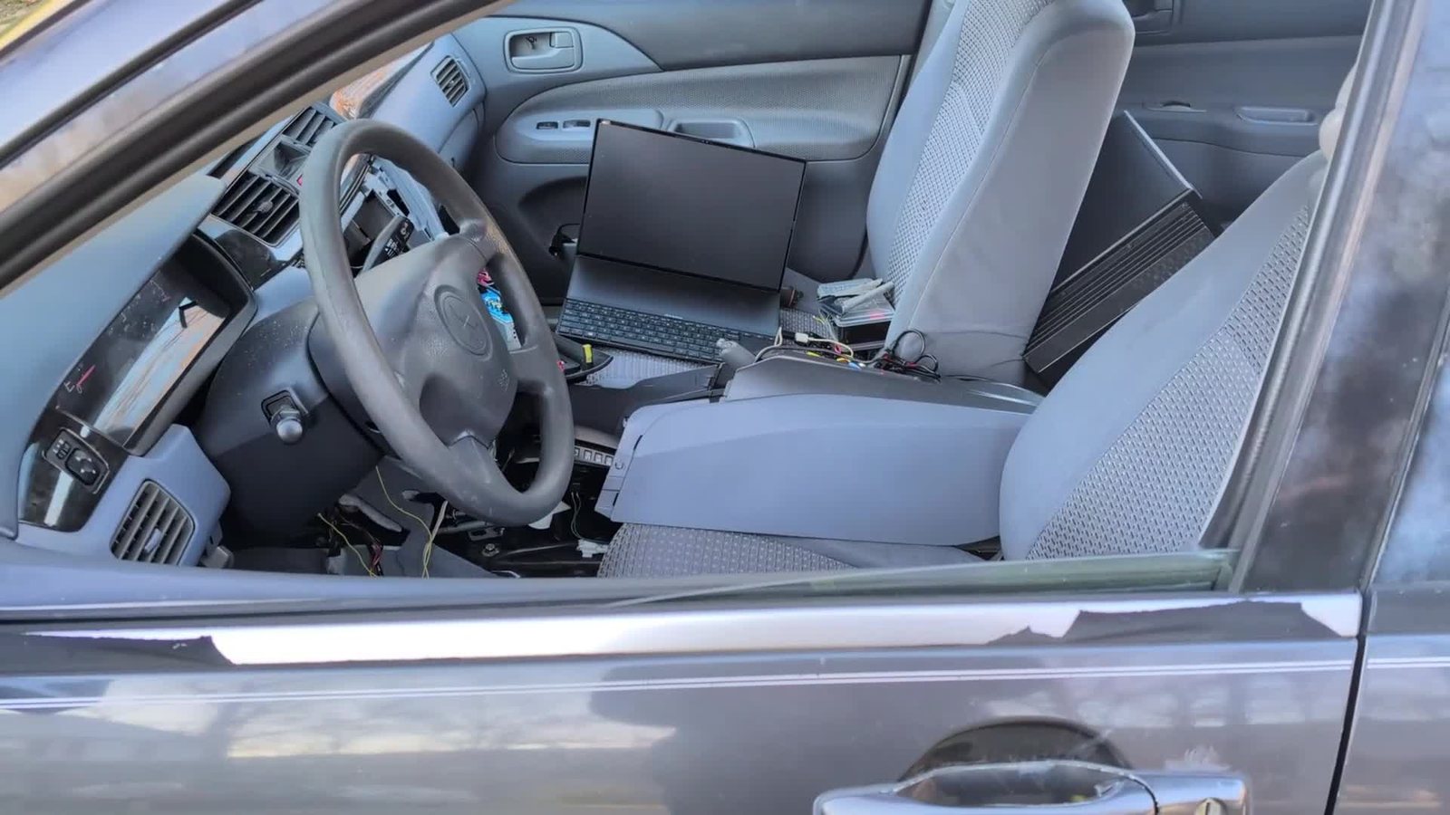View through the open driver's door into the cabin during the demo.